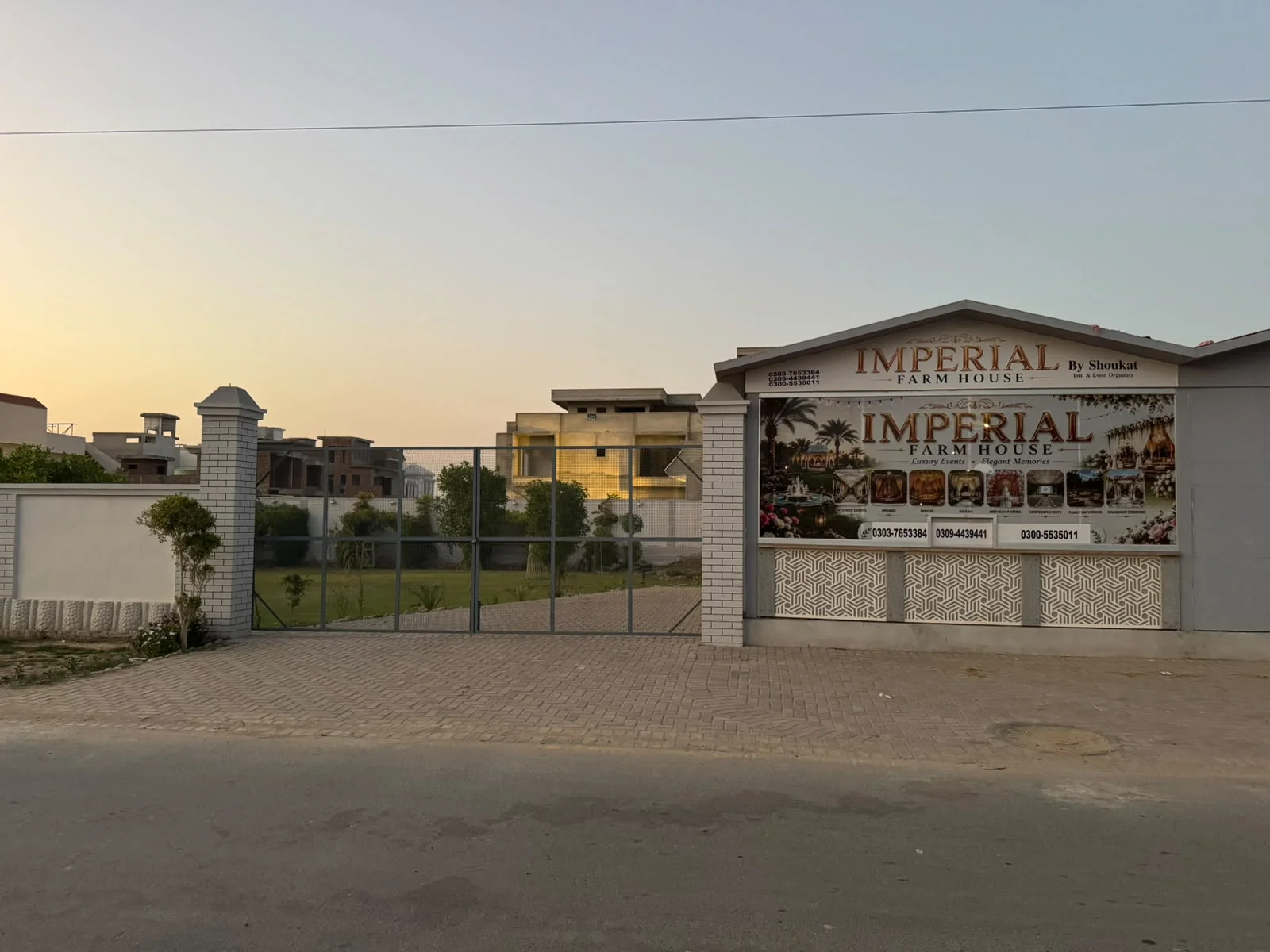 Entrance gate and Imperial Farmhouse sign in Rahim Yar Khan at sunset
