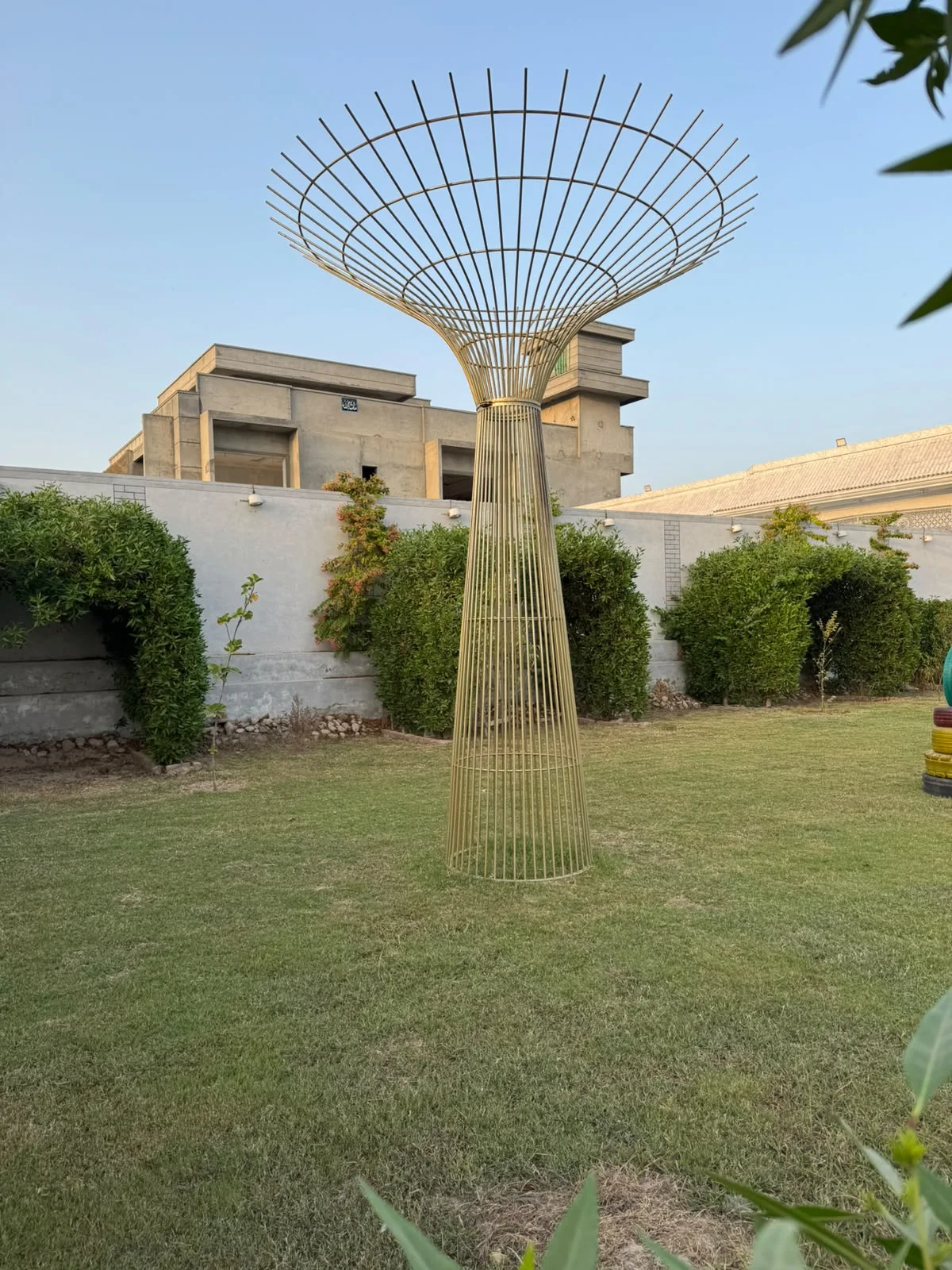 Golden garden sculpture and landscaped lawn at Imperial Farmhouse